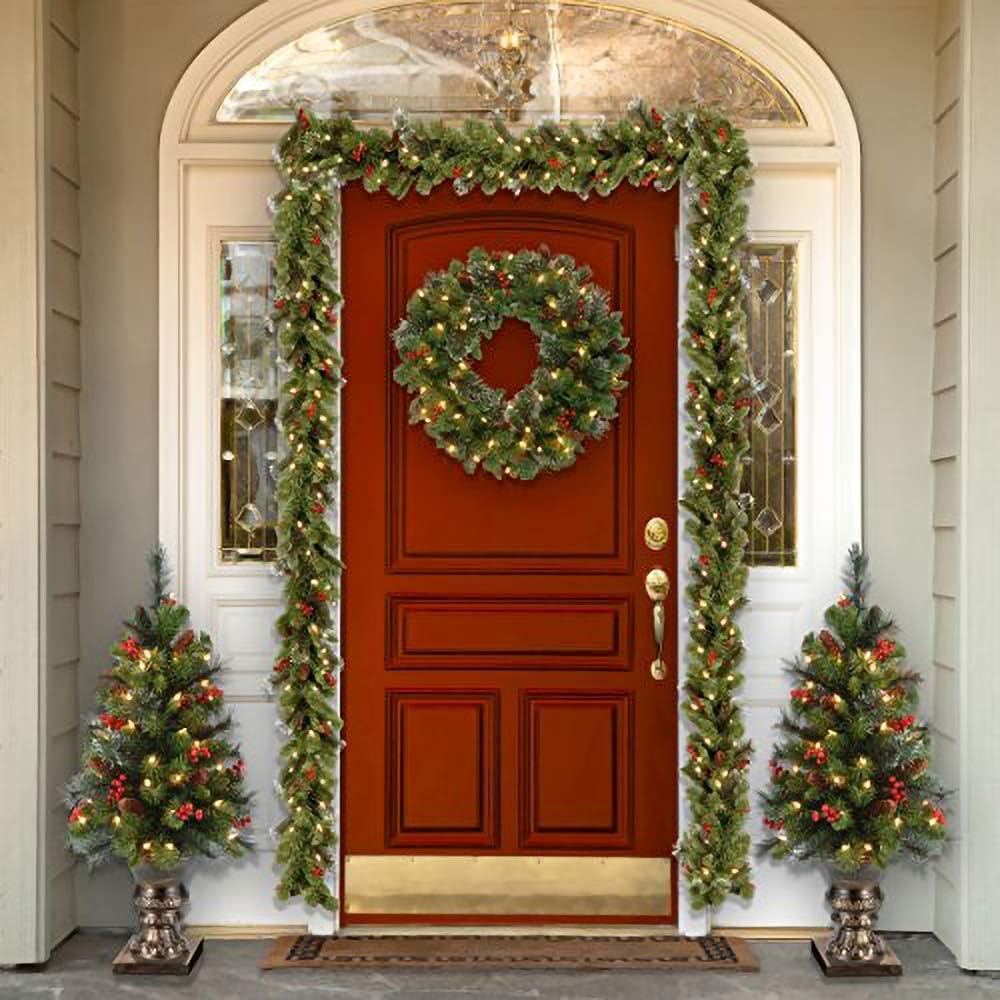 National Tree Company 24 in Pre-Lit Crestwood Spruce Artificial Christmas Wreath, Christmas Decoration with Glitter, Pinecones, Red Berries, 50 Clear LED Lights, 160 Tips, Timer, Green